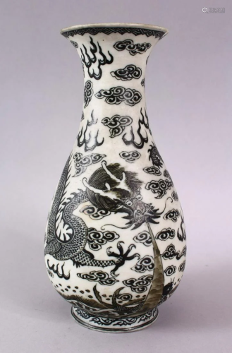 A CHINESE PORCELAIN DRAGON VASE, the dragon amongst