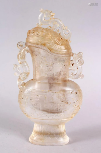 A CHINESE CARVED GLASS VASE & COVER, carved with
