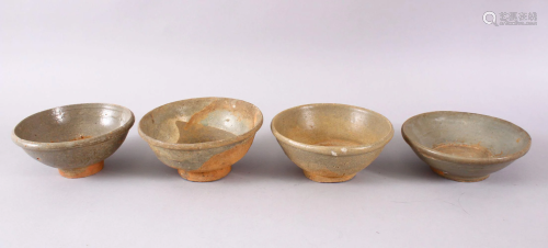 FOUR EARLY CHINESE GREEN GLAZED POTTERY BOWLS, 15m down