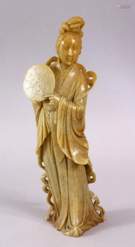 A CHINESE CARVED SOAPSTONE FIGURE OF GUANYIN, …