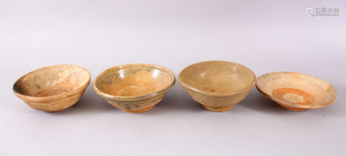 FOUR EARLY CHINESE POTTERY BOWLS, 15.5cm down to 14.5cm