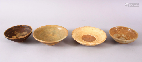 FOUR EARLY CHINESE POTTERY BOWLS, 13.5cm down to 11cm.