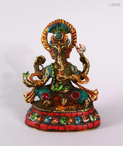 A TIBETAN BRONZE FIGURE OF AN ELEPHANT GOD, with multi