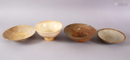 FOUR EARLY CHINESE POTTERY BOWLS, 17cm down to 14.5cm.