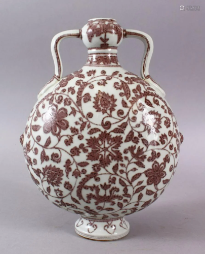 A CHINESE COPPER RED DECORATED PORCELAIN TWIN HAN…