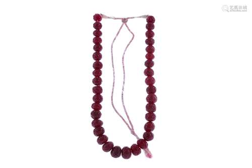 A CARVED RUBY NECKLACE