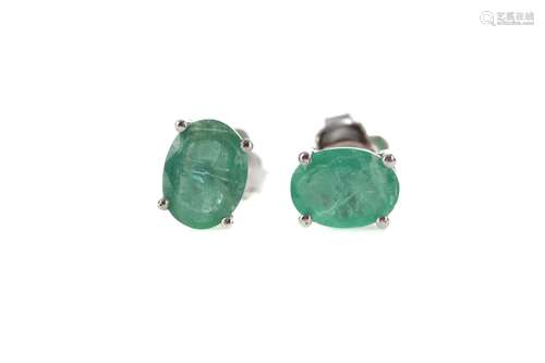 A PAIR OF EMERALD STUD EARRINGS