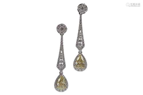 A PAIR OF CERTIFICATED YELLOW DIAMOND EARRINGS