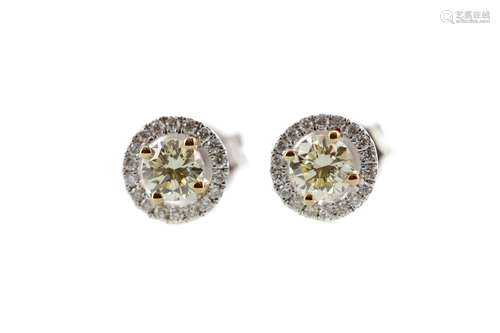 A PAIR OF CERTIFICATED YELLOW DIAMOND STUD EARRINGS