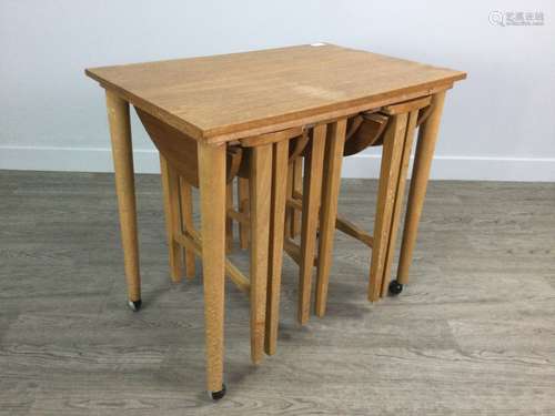 A SET OF FOUR TEAK MORPHIC DROP LEAF NESTING TABLES BY POUL ...