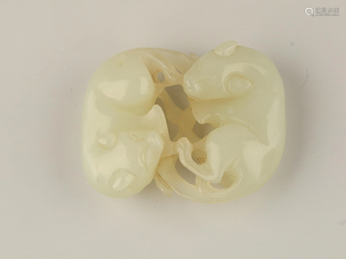 A CARVED WHITE JADE BEAST GROUP