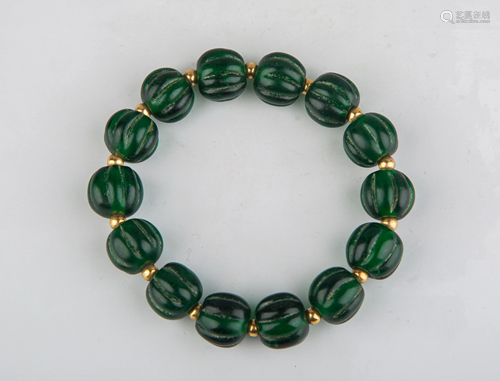 A GREEN GLASS BRACELET