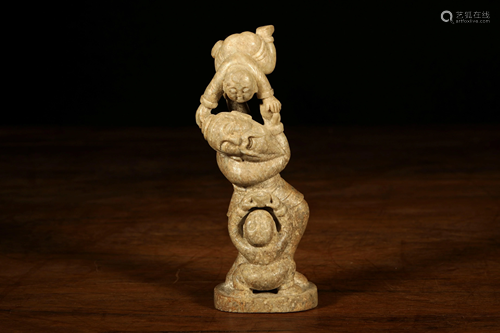 A CARVED JADE FIGURES