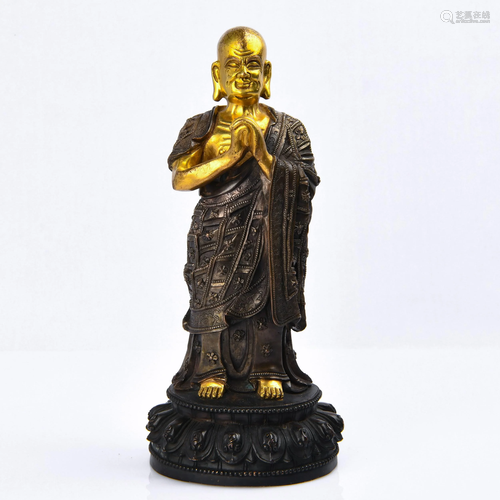 A GILT-BRONZE FIGURE OF LUOHAN