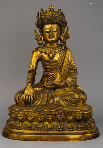 A GILT-BRONZE FIGURE OF SAKYAMUNI