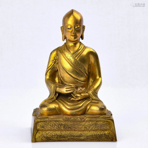 A GILT-BRONZE FIGURE OF LUOHAN