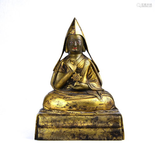 A GILT-BRONZE FIGURE OF TSONGKHAPA