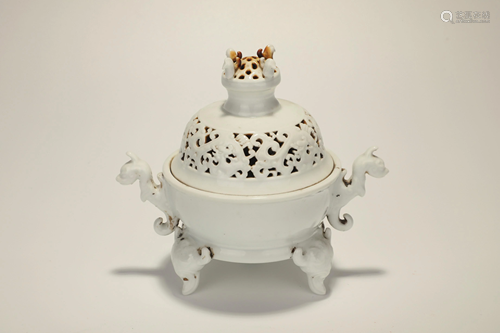 A CARVED WHITE -GLAZED TRIPOD CENSER AND COVER.MARK …