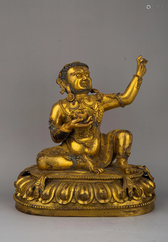 A GILT-BRONZE FIGURE OF MAHASIDDHAS