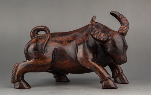 A CARVED JADE BUFFALO