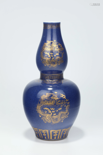A BLUE -GROUND GILT-DECORATED DOUBLE-GOURD VASE.…