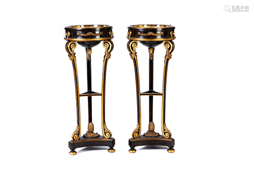 PAIR OF EBONIZED AND GILT PAINTED TORCHIERES