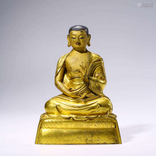 A Gilt-bronze Statue of Guru Buddha