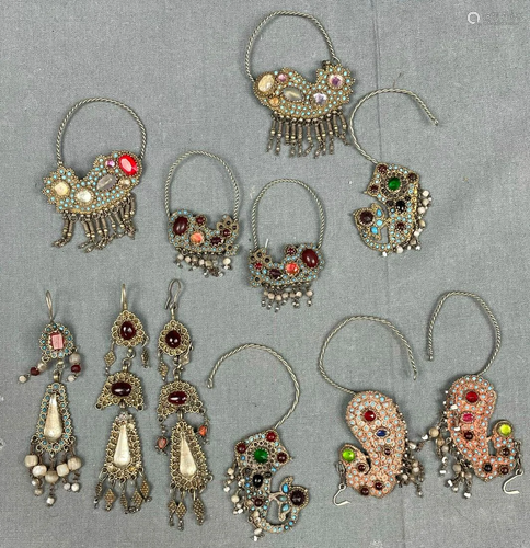 5 pairs of earrings and one single. Probably India,