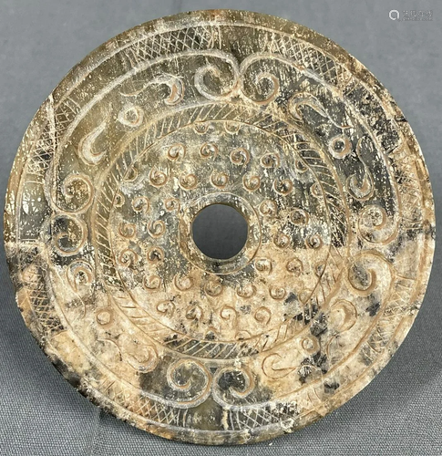 A disk made of stone. Probably Jade, China, Bi Disc,