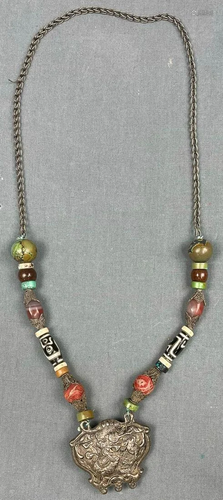 Necklace chain with dragon pendant. Probably Tibet,