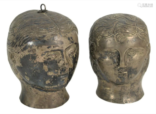 Pair of Silver Heads in the form of a man and woman,