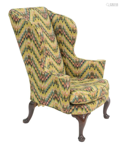 Queen Anne Upholstered Wing Chair having rolled out