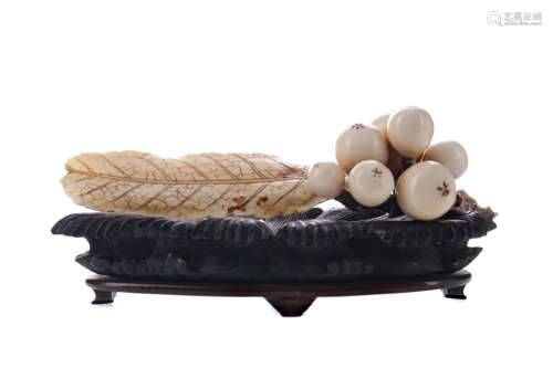 A JAPANESE IVORY CARVING OF BERRIES AND LEAVES