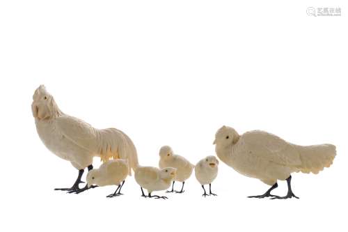 A JAPANESE IVORY CARVING OF A FAMILY OF CHICKENS