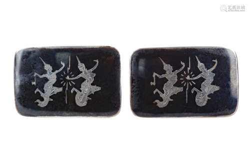 A LOT OF TWO SIAMESE SILVER AND ENAMEL BUCKLES