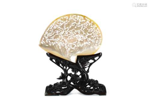 A CHINESE ABALONE SHELL ON WOOD STAND