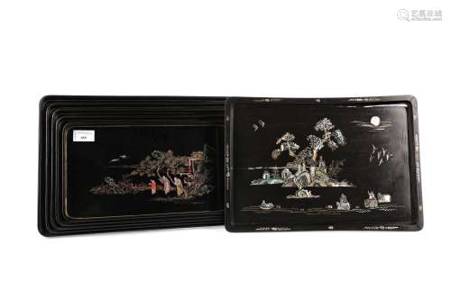 A SET OF FIVE CHINESE LACQUERED RECTANGULAR TRAYS AND A MOTH...