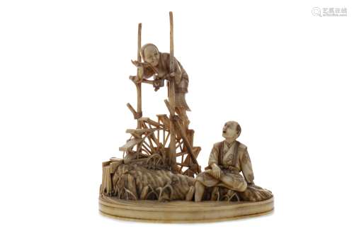 A JAPANESE IVORY CARVING OF FARMERS AND A WATER WHEEL