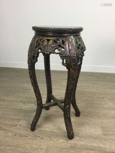 A CHINESE CARVED WOOD PLANT TABLE