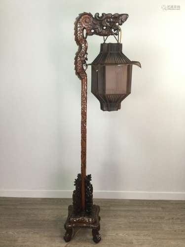 A CHINESE CARVED WOOD FLOOR STANDING LAMP