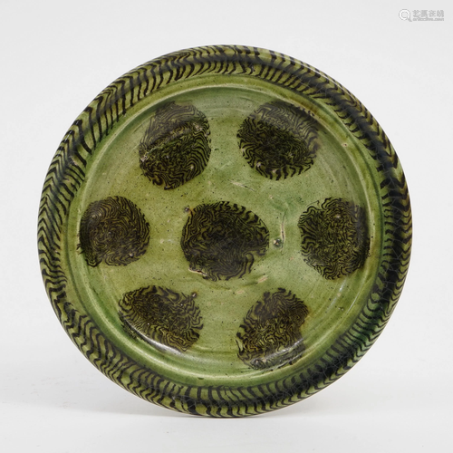 A GREEN-GLAZED PLATE