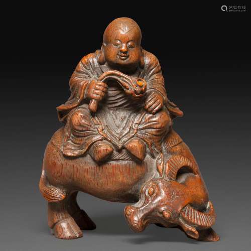 STATUETTE en bambou sculpté, représentant un bouvier assis s...