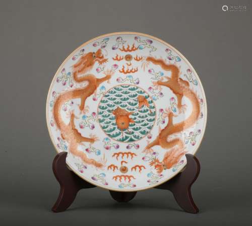 A allite red glazed 'dragon' dish painting in gold