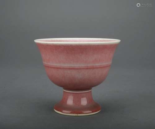 A monochromatic glazed cup