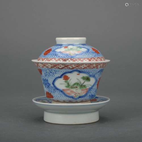 A Wu cai teacup and holder