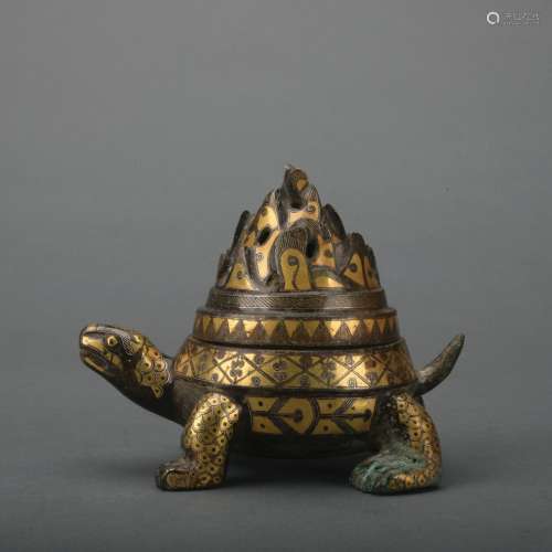 A bronze turtle incense burner ware with gold