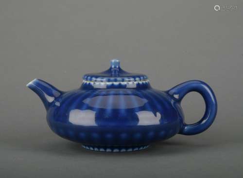 A blue glazed teapot