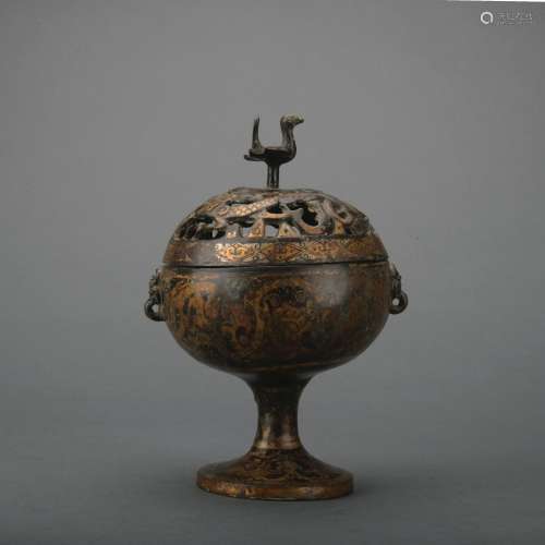 A bronze incense burner ware with gold and silver