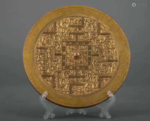 A gilt-bronze mirror