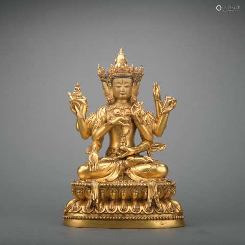 A gilt-bronze statue of Eight armed Guanyin
